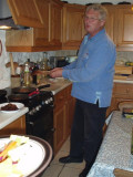Mick cooking burgers - apprehensively