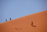 A couple climbing the sand dune we were on.