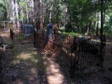Wrought Iron fences around most graves