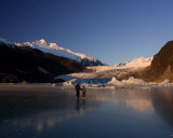 Mendenhall Lake is frozen solid now and these people are skating on the frozen surface