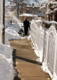 cleaning the sidewalk after the snowstorm
