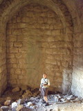 Bob inside a large chamber.  It could be a church, storage, or quarters--we dont know.