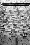 Kid playing next Monument to Pertini