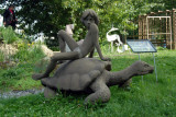 Statue of Mowgli from Disneys The Jungle Book sitting on a tortise, Sculpture Garden of the House of Artists