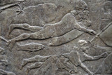 Wall panel depicting soldiers crossing a river floating on inflated animal skins, Assyrian ca 860 BC, Nimrud northwest palace