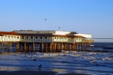 An old pier in Galveston with the Balinese Room Beach Bar