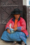 Woman with a bag of coca leaves