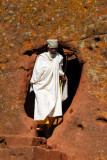 Priest emerging from a passage, Lalibela