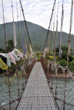 Wire suspension bridge across the river