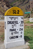 Road marker at Chuzom on the road to Paro and Drugyel