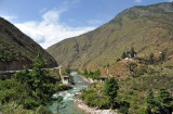 Scenic spot along the Paro River with a pair of bridges and a small temple, Tamchhog Lhakhang