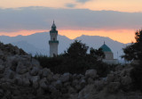 Minaret of a mainland mosque with the coastal mountain range, Suakin