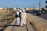 Men walking along the railway tracks, Port Sudan
