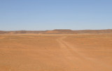 Dusty track across the open desert northwest of Khartoum