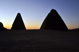 Silhouettes of the Karima pyramids in the pre-dawn light