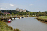 Boats tied up on the banks of the Arun River with Arundel Castle
