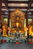 Śākyamuni Buddha flanked by two disciples