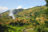 Hillside village with a burning field, Nepal