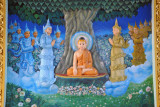 Colorful relief of Buddha beneath the Bodhi Tree