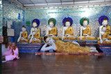 Buddhist nuns praying in a mirrored pavilion
