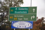 Road sign for Kimberley Airport and Bloemfontein via N8