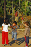 Children playing on the swing, Sauraha Chowk (Tandi Bazaar)