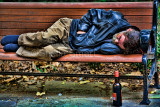 Man asleep on bench using topaz filter spicify