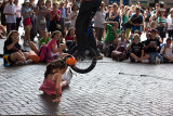 Busker jumping over girl