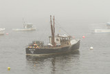 Lobster boat in the fog