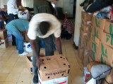 each worker that helped unload received a box of food as pay to take home with their families
