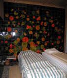 Bedroom with tiled wall