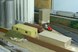 Cardboard office mock-up next to finished styrene building