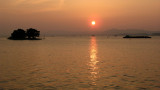 Yomegashima and firework barge with sunset
