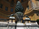 Bronze pinecone and peacocks in the courtyard