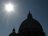 The sun over the cupola of St. Peters