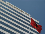 Albanian flag and Tirana International Hotel
