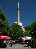 Minaret of Sinan Pasha Mosque and nearby cafes