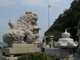 Stone dragon and lanterns at Futaminoura