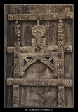 Old wooden door with handmade ornments