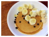 Children love home-made pancakes with blueberries and bananas