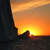 Sun Setting Behind Icebergs