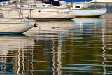 Reflections In the Water and On The Boats