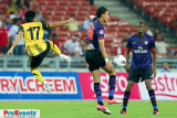 Mohd Shakir Shaari (17) clears a pass intended for M. Chamakh