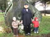 Nanoo in front of a huge cut tree