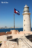 lighthouse and flag at El Morro Fort