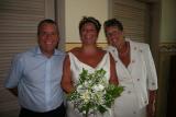 Alison with mom and dad before the wedding reception