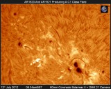 AR1520 AND AR1521 PRODUCING A C1 CLASS FLARE 12th JULY 2012.jpg