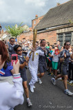 The Olympic Torch passes along Palace Street in Canterbury