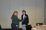 MJ receives certificate of service with a smile