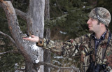 Aron feeding a Black-capped Chickadee